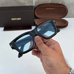 T0m F0rd 184 Black-Blue Sunglass (Shining) with glossy black frame and stylish blue lenses. UV400 protection with premium shine finish for a bold and modern look.